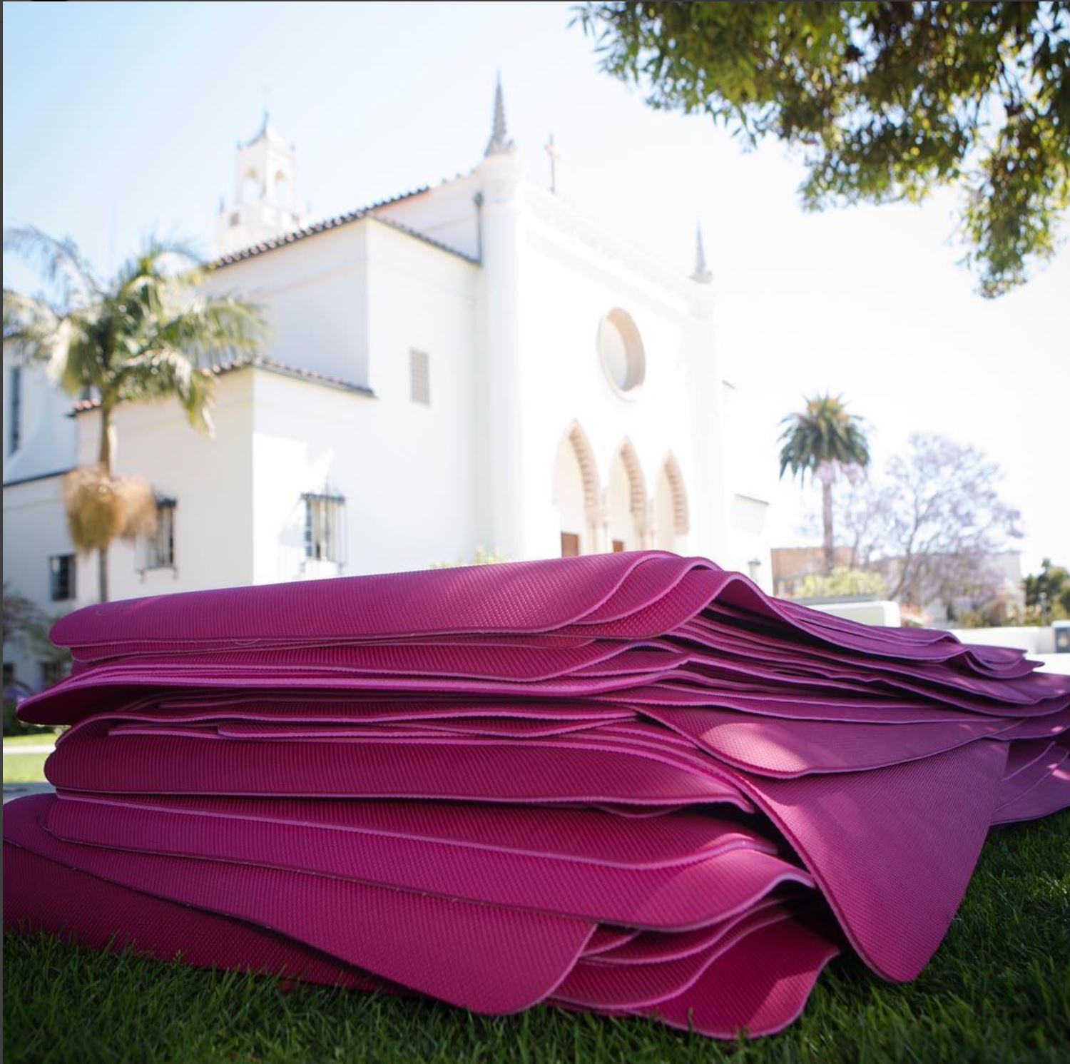 Pile of yoga mats outside chapel 